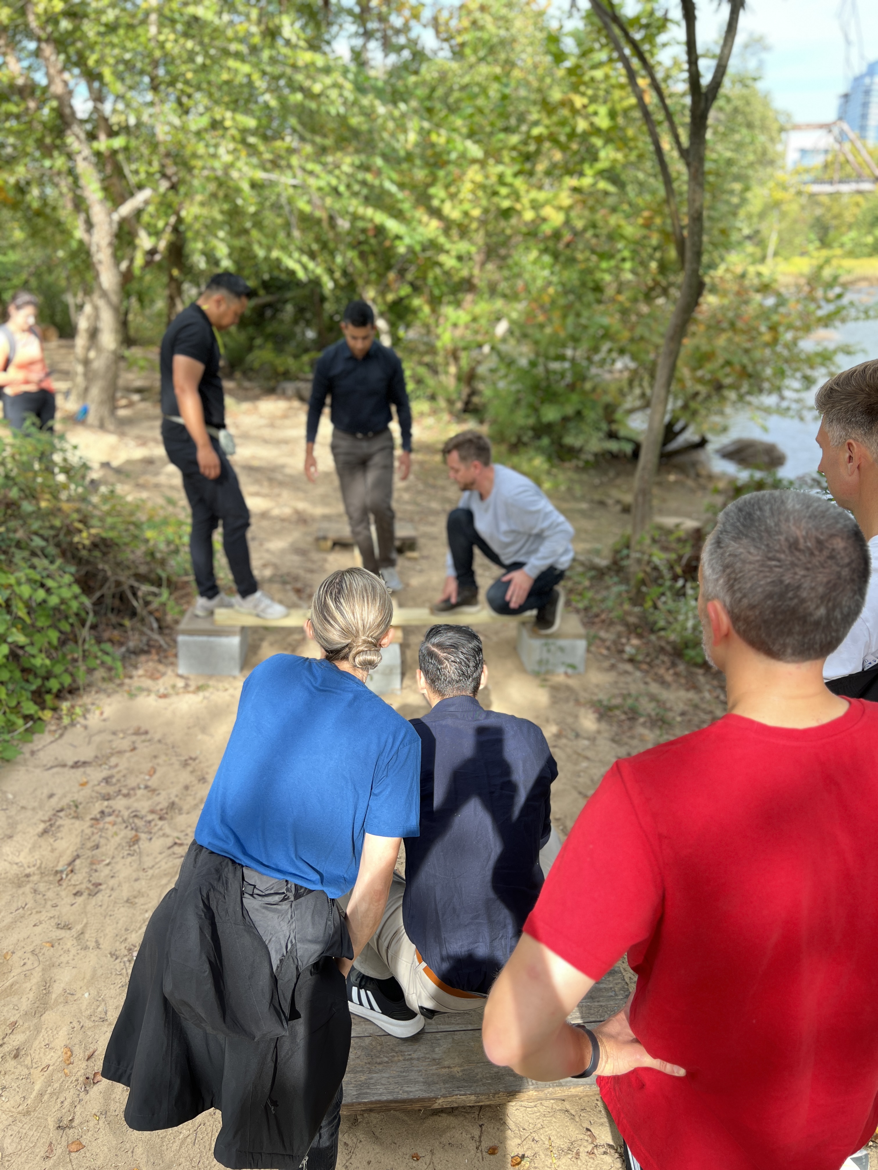 Team on island riverbank